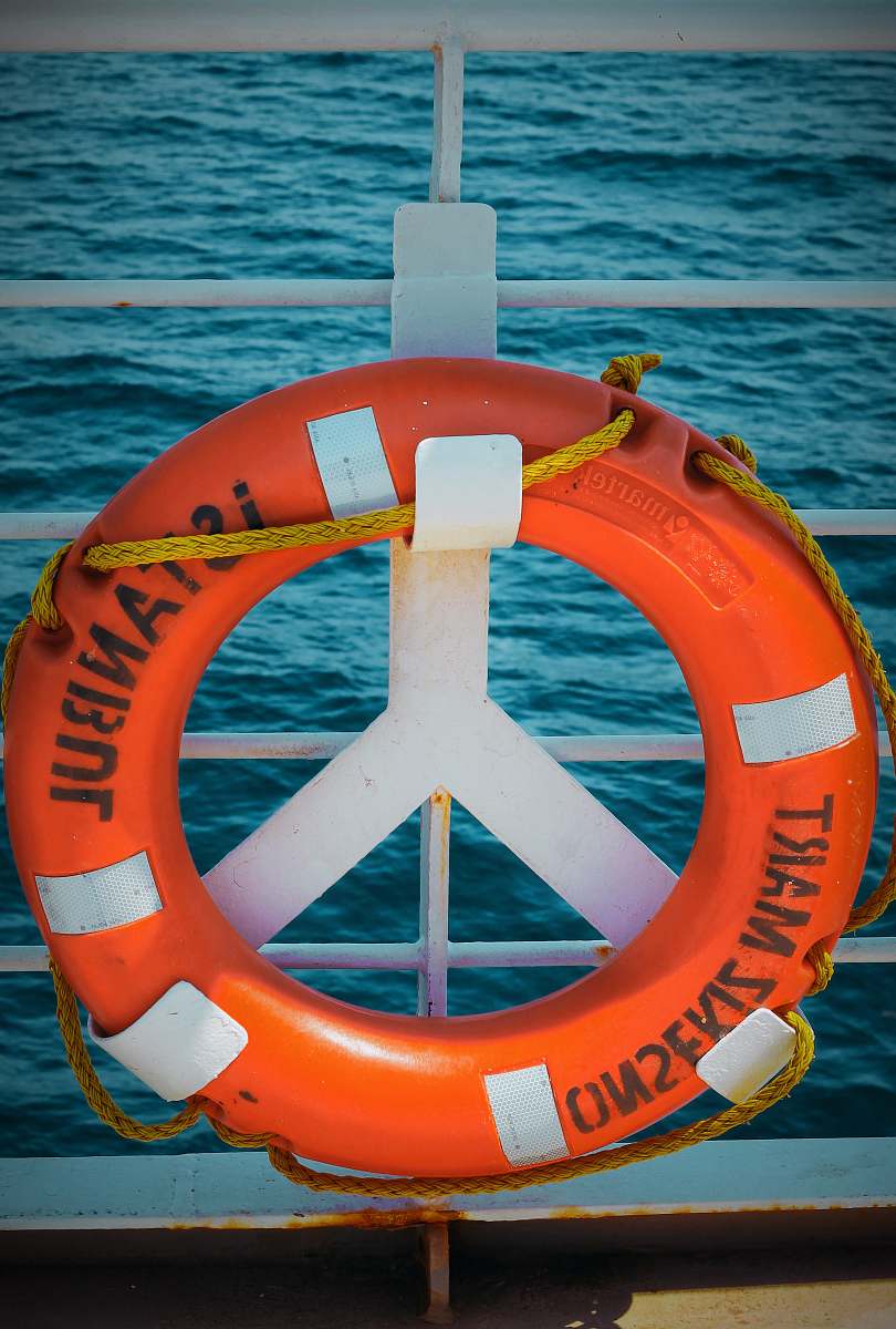 flip orange life buoy water